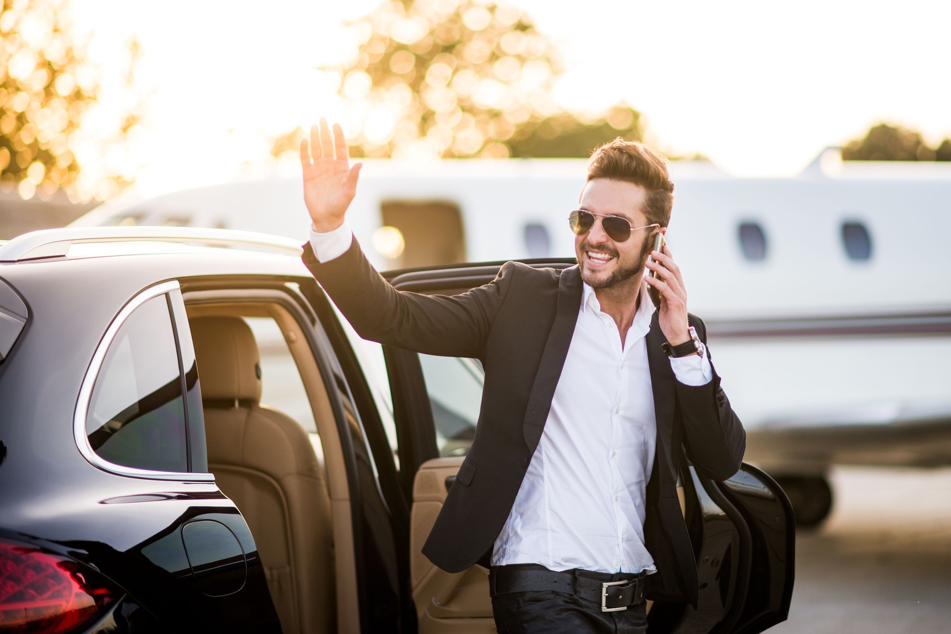 Man on the airport waving around